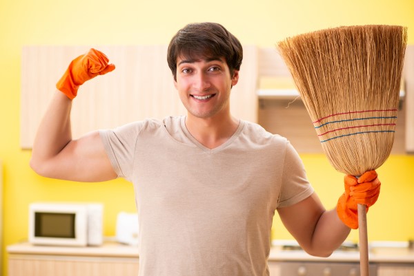 man with broom